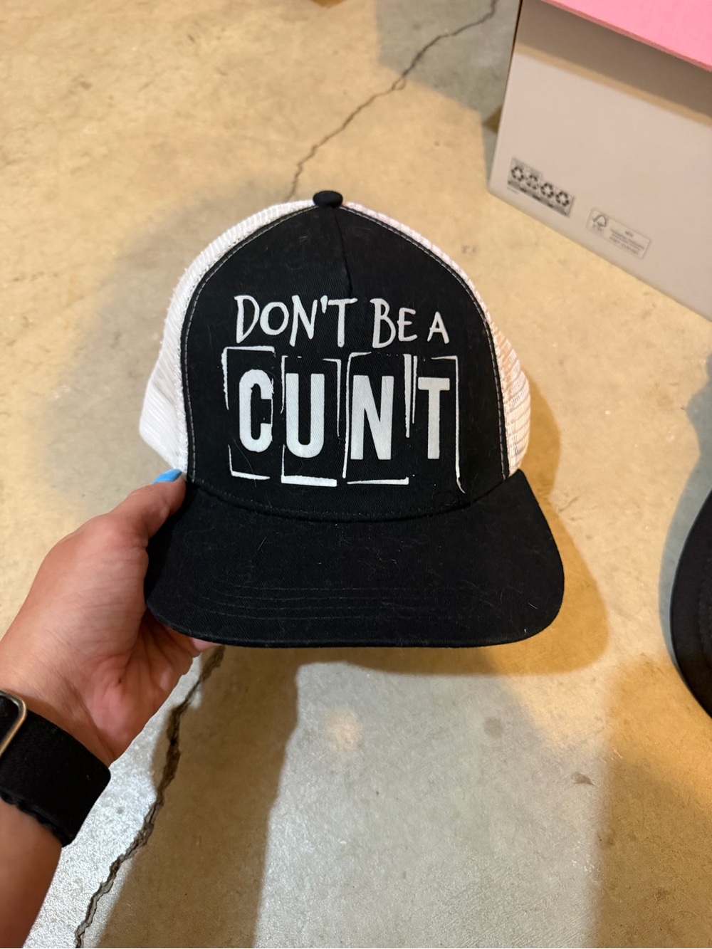 Black and White Trucker Hat with Bold White Slogan